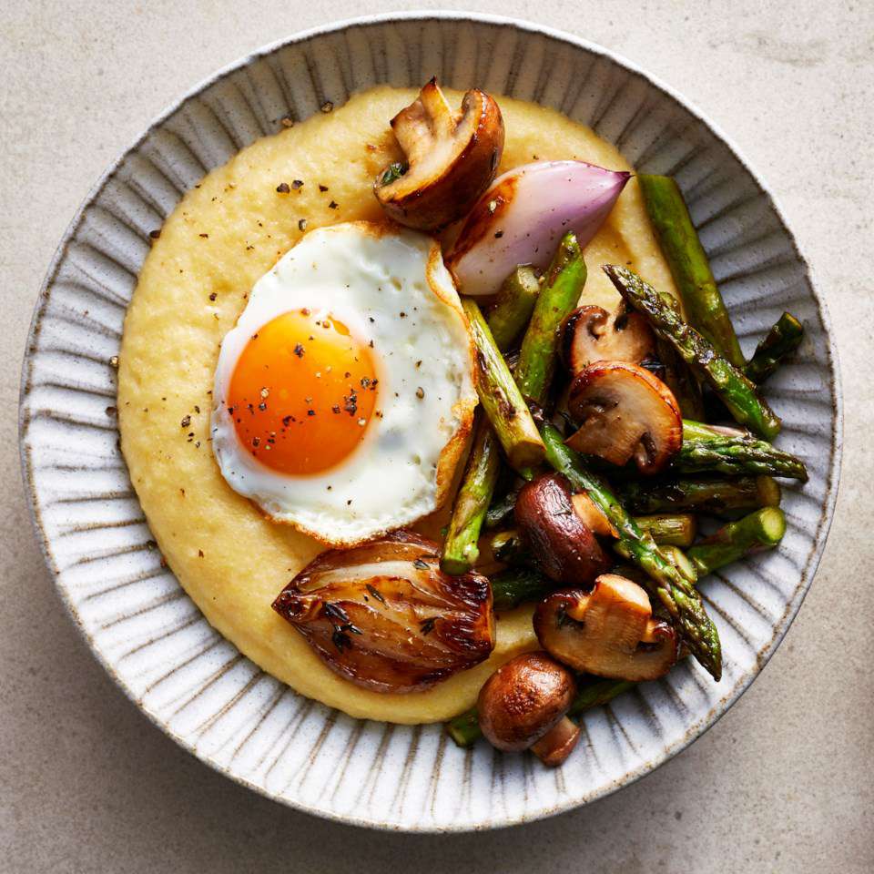 Polenta Bowl with roasted veggies and a fried etgg