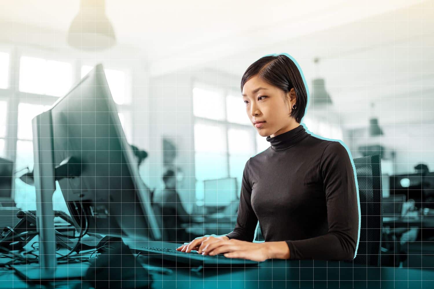 a photo of a woman working at a desk