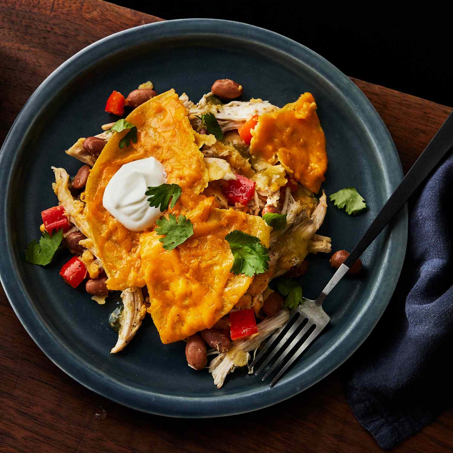 a recipe photo of the Slow-Cooker Chicken & Pinto Bean Enchilada Casserole served on a plate